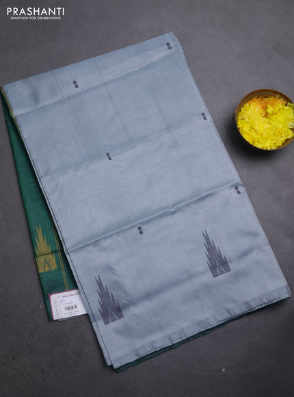 Banana pith saree grey shade and bottle green with thread woven buttas in borderless style