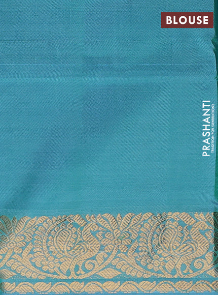Banana pith saree dual shade of greenish pink and teal blue with thread woven buttas and zari woven border