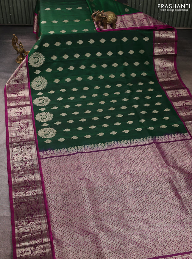 Venkatagiri silk saree bottle green and magenta pink with allover silver zari woven buttas and silver zari woven border