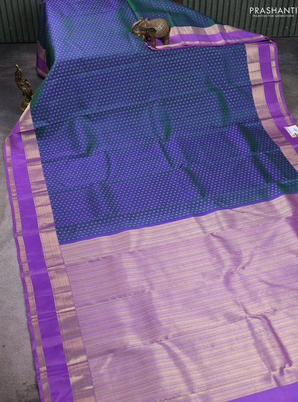 Pure kanchipuram silk saree dual shade of bluish green and lavender with allover zari woven 1000 buttas and rettapet zari woven border