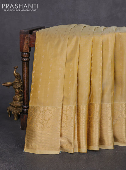 Pure kanchipuram silk saree beige with allover zari woven 1000 buttas and long zari woven border