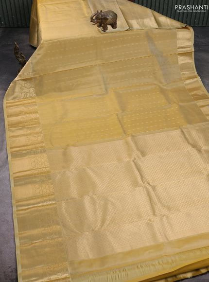 Pure kanchipuram silk saree beige with allover zari woven 1000 buttas and long zari woven border