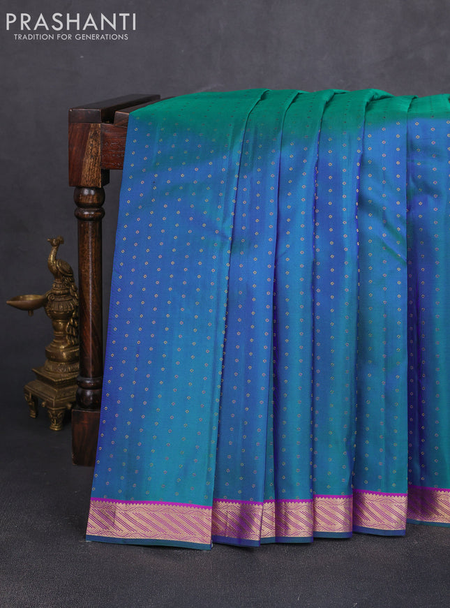 Pure kanchipuram silk saree dual shade of bluish green and pink with allover zari woven 1000 buttas and small zari woven border
