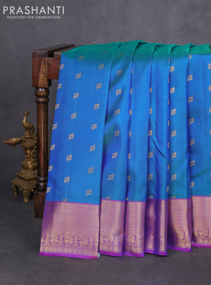Pure kanchipuram silk saree dual shade of bluish green and purple with allover zari woven 1000 buttas and rettapet zari woven border