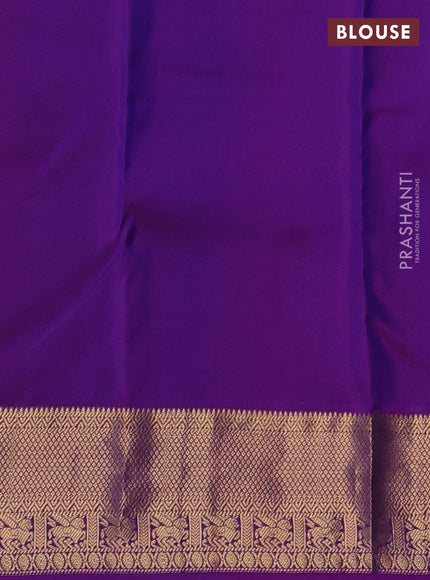 Pure kanchipuram silk saree dual shade of bluish green and purple with allover zari woven 1000 buttas and rettapet zari woven border