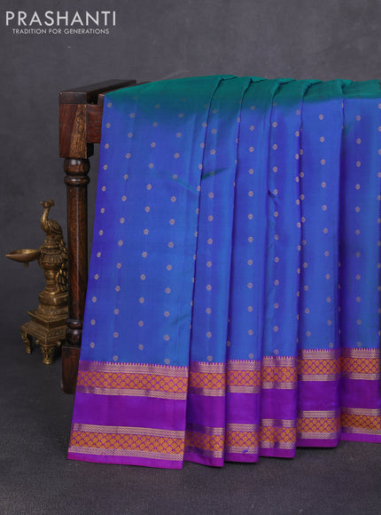 Pure kanchipuram silk saree dual shade of bluish green and purple with allover zari woven 1000 buttas and rettapet zari woven border