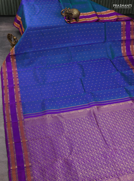 Pure kanchipuram silk saree dual shade of bluish green and purple with allover zari woven 1000 buttas and rettapet zari woven border
