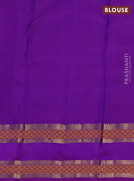 Pure kanchipuram silk saree dual shade of bluish green and purple with allover zari woven 1000 buttas and rettapet zari woven border