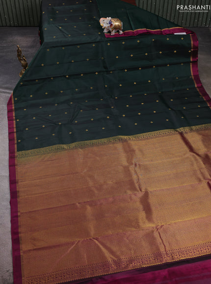 Pure kanchipuram silk saree bottle green and magenta pink with allover zari woven buttas and small zari woven simple border
