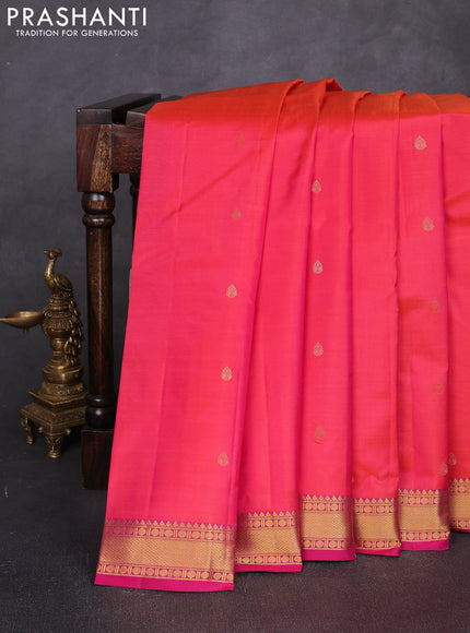Pure kanchipuram silk saree dual shade of pinkish orange and pink with allover zari woven buttas and small zari woven border