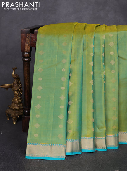 Pure kanchipuram silk saree dual shade of greenish yellow and teal green with allover zari woven buttas and small zari woven border