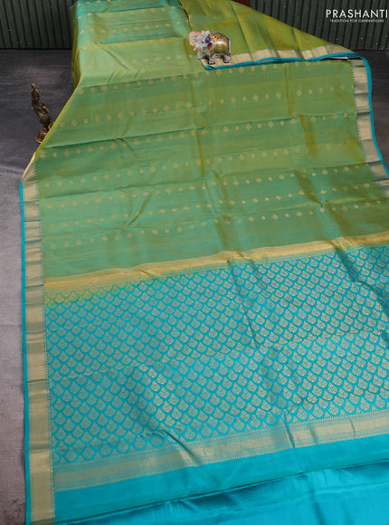 Pure kanchipuram silk saree dual shade of greenish yellow and teal green with allover zari woven buttas and small zari woven border