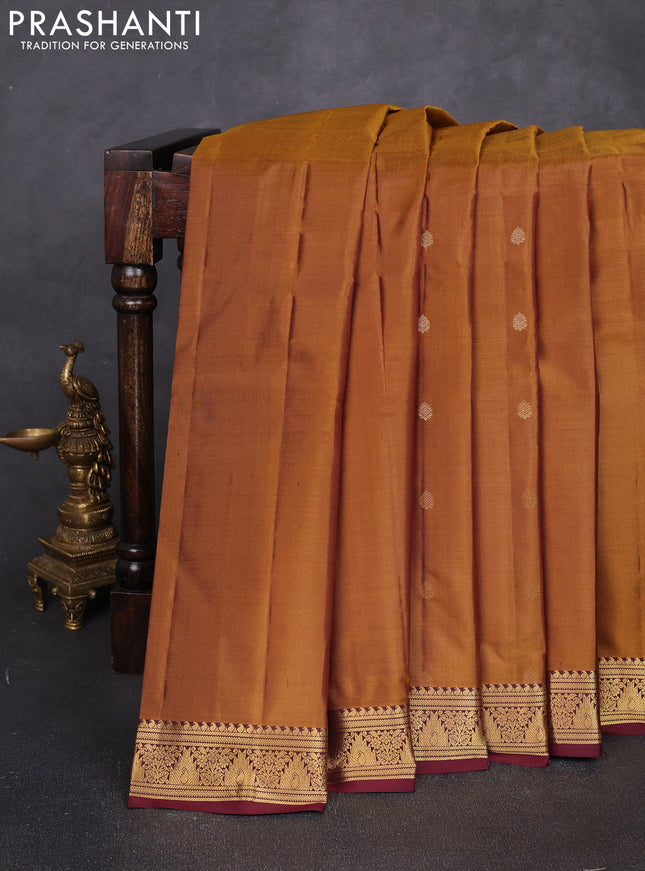 Pure kanchipuram silk saree dark mustard and deep maroon with allover zari woven buttas and small zari woven border