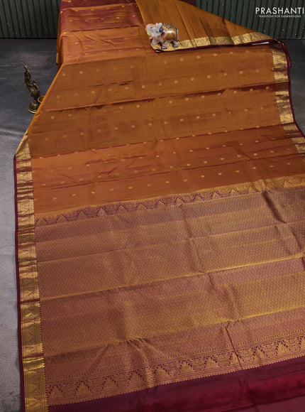 Pure kanchipuram silk saree dark mustard and deep maroon with allover zari woven buttas and small zari woven border