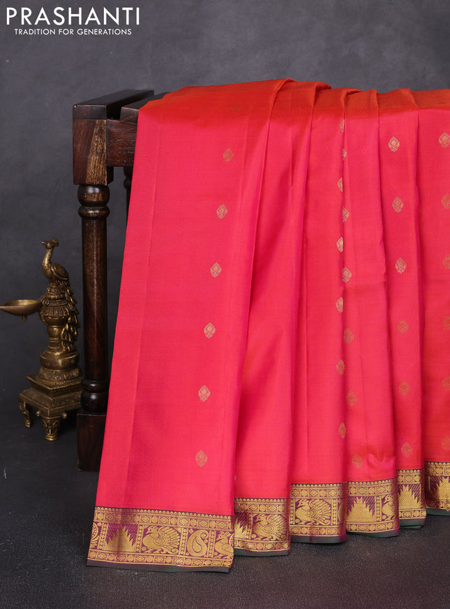 Pure kanchipuram silk saree dual shade of pinkish orange and green with allover zari woven buttas and small zari woven border