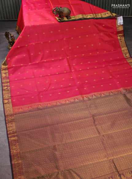 Pure kanchipuram silk saree dual shade of pinkish orange and green with allover zari woven buttas and small zari woven border