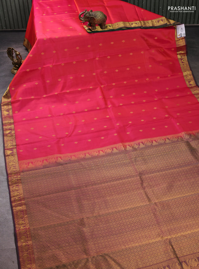Pure kanchipuram silk saree dual shade of pinkish orange and green with allover zari woven buttas and small zari woven border