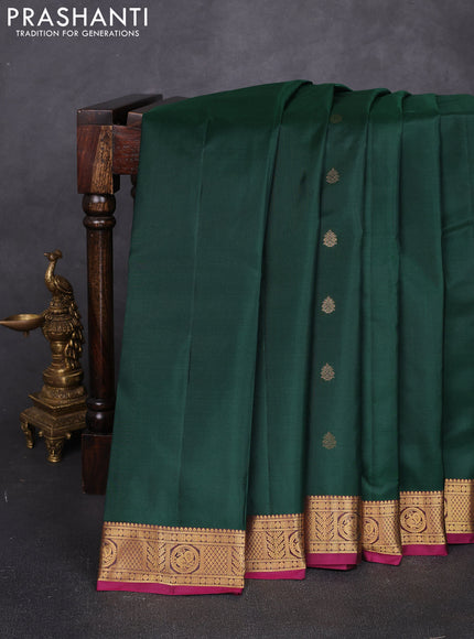 Pure kanchipuram silk saree bottle green and magenta pink with allover zari woven buttas and small zari woven border