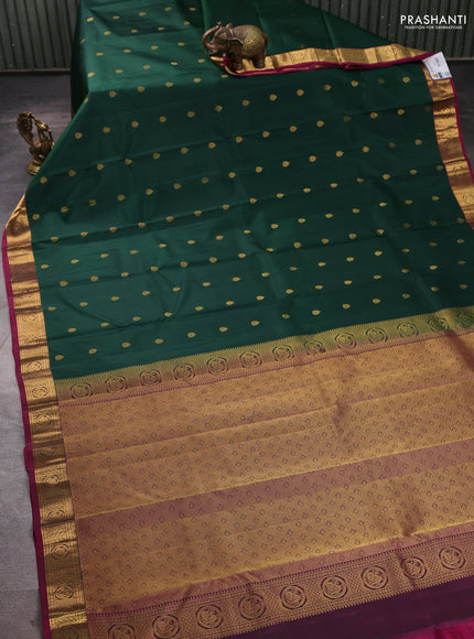 Pure kanchipuram silk saree bottle green and magenta pink with allover zari woven buttas and small zari woven border
