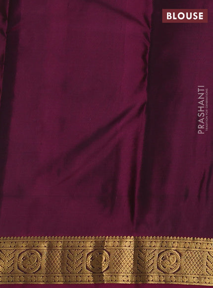 Pure kanchipuram silk saree bottle green and magenta pink with allover zari woven buttas and small zari woven border
