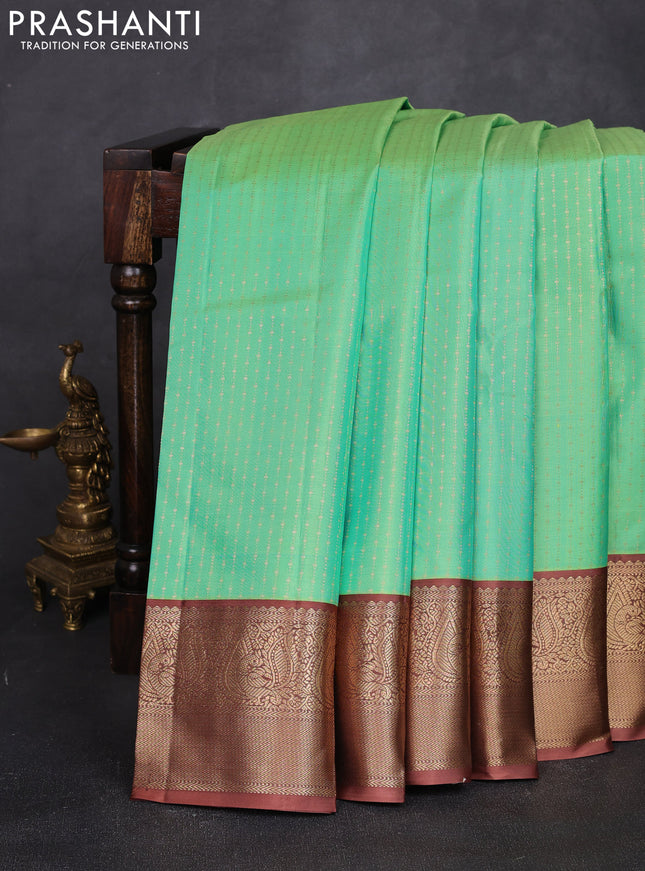 Pure kanchipuram silk saree teal green and dark sandal with allover weaves & zari woven 1000 buttas and zari woven border