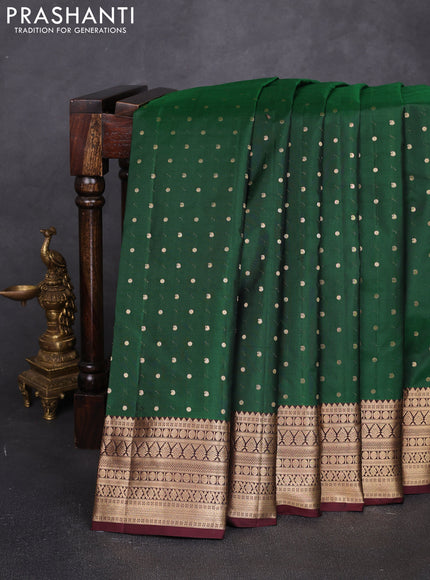 Pure kanchipuram silk saree bottle green and coffee brown with allover zari woven 1000 buttas and zari woven korvai border