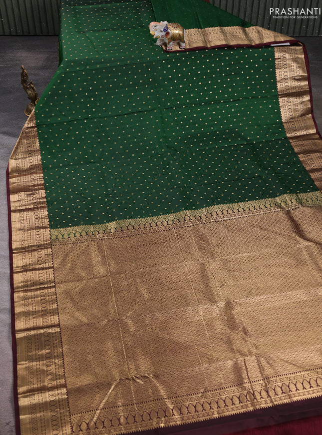 Pure kanchipuram silk saree bottle green and coffee brown with allover zari woven 1000 buttas and zari woven korvai border