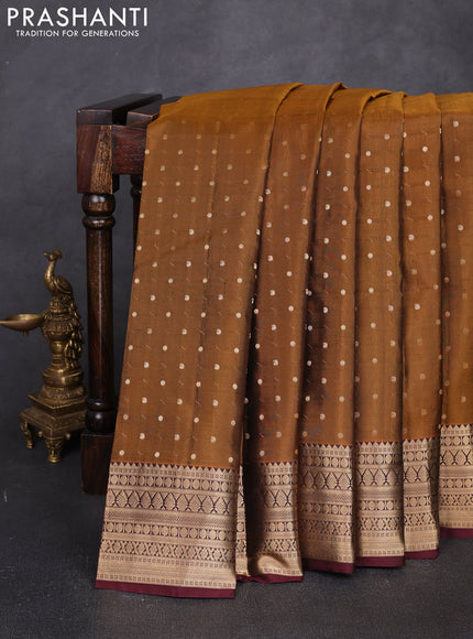 Pure kanchipuram silk saree dark mustard and coffee brown with allover zari woven 1000 buttas and zari woven korvai border