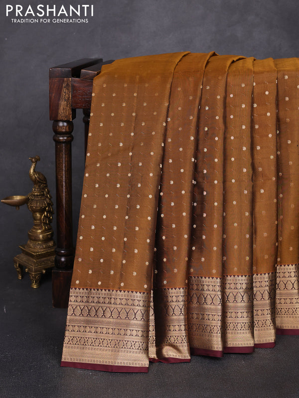 Pure kanchipuram silk saree dark mustard and coffee brown with allover zari woven 1000 buttas and zari woven korvai border