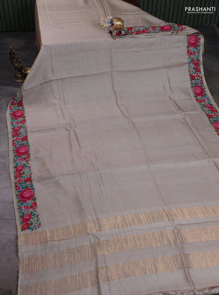 Pure tussar silk saree pastel grey with allover zari woven buttas and floral embroidery border