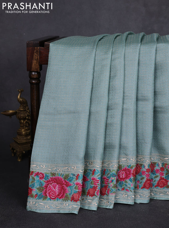 Pure tussar silk saree pastel blue with allover zari woven buttas and floral embroidery border