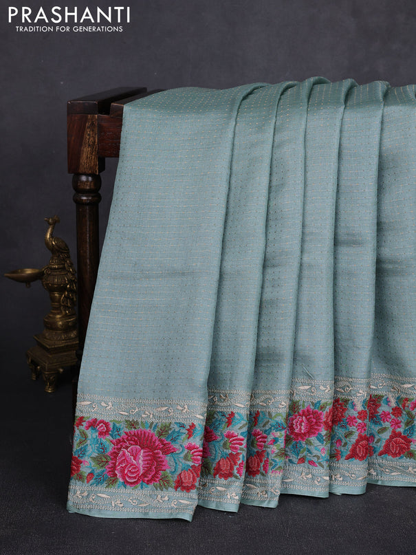 Pure tussar silk saree pastel blue with allover zari woven buttas and floral embroidery border