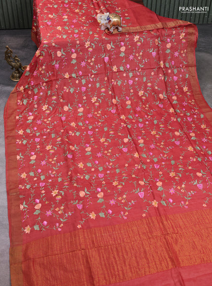 Pure tussar silk saree rust shade with allover floral embroidery work and zari woven border