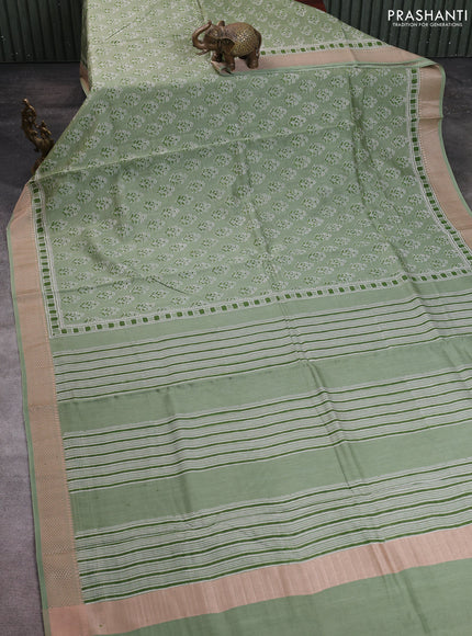 Maheshwari silk cotton saree pastel green with allover floral butta block prints and thread woven border