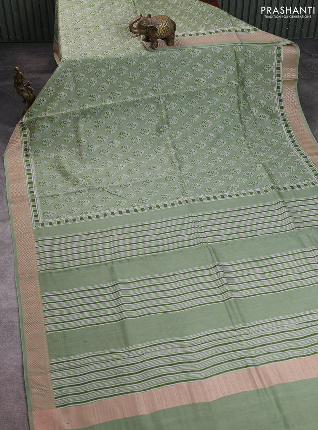 Maheshwari silk cotton saree pastel green with allover floral butta block prints and thread woven border