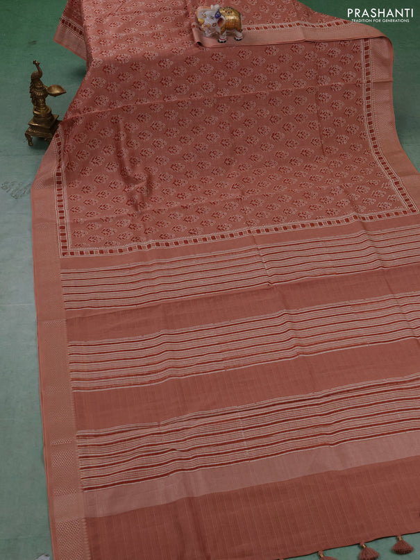 Maheshwari silk cotton saree pastel peach shade with allover floral butta block prints and thread woven border