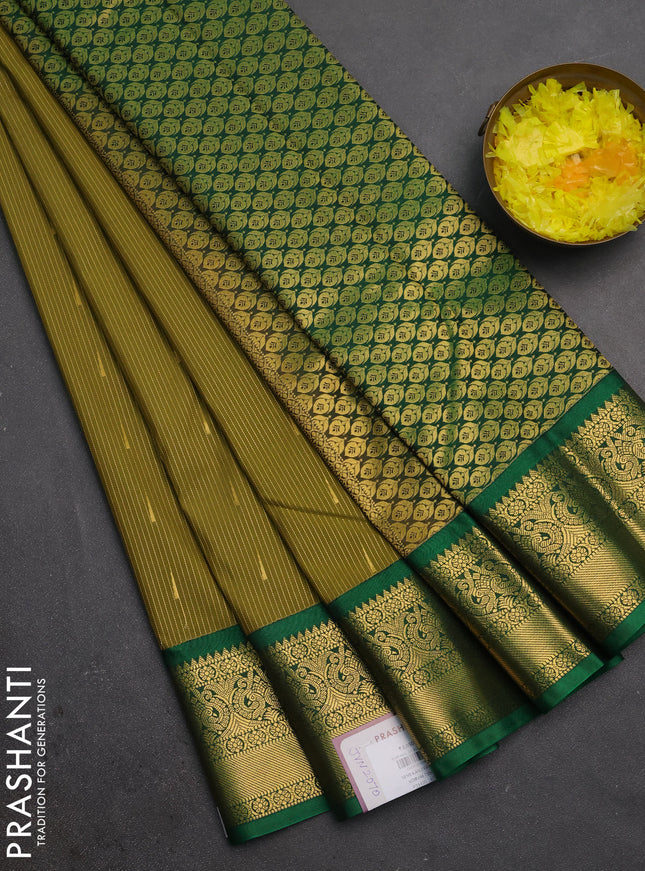 Semi kanchipuram silk saree mehendi green and green with allover zari weaves & buttas and zari woven border