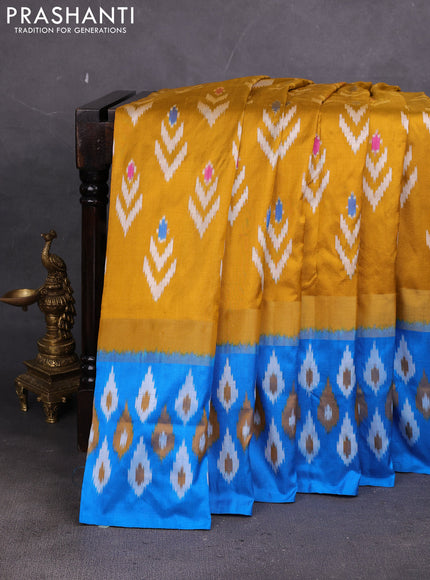 Pochampally silk saree dark mustrard and cs blue with allover ikat woven buttas and ikat zari woven border