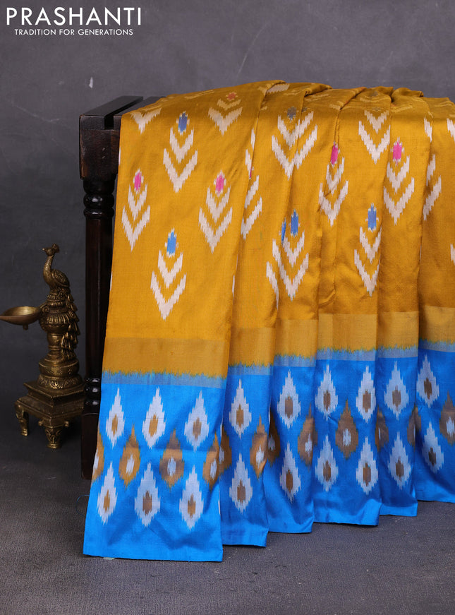 Pochampally silk saree dark mustrard and cs blue with allover ikat woven buttas and ikat zari woven border