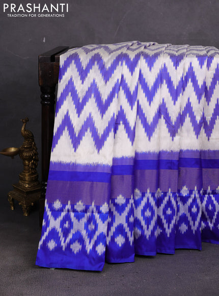 Pochampally silk saree off white and blue with allover ikat weaves and long ikat zari woven border