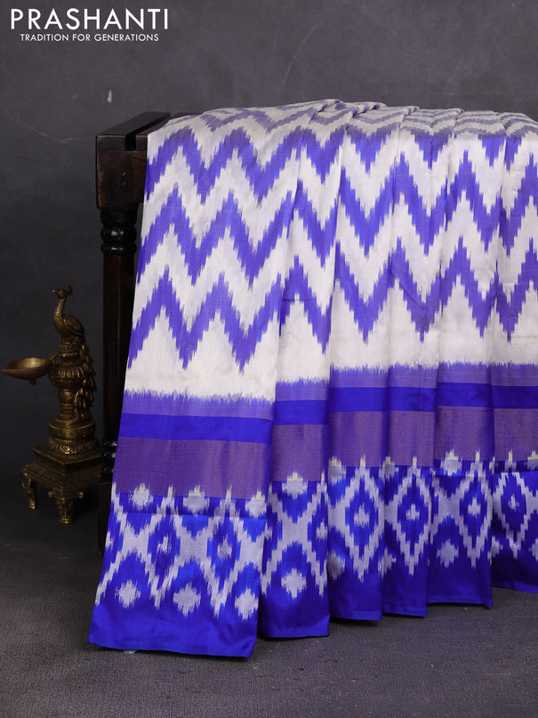 Pochampally silk saree off white and blue with allover ikat weaves and long ikat zari woven border