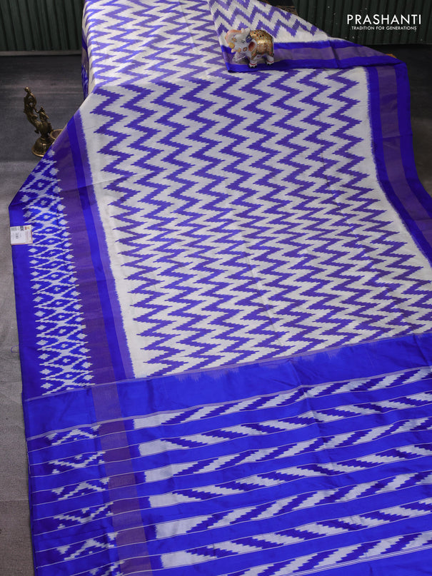 Pochampally silk saree off white and blue with allover ikat weaves and long ikat zari woven border