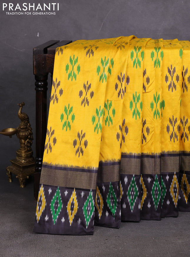Pochampally silk saree yellow and black with allover ikat woven buttas and ikat zari woven border