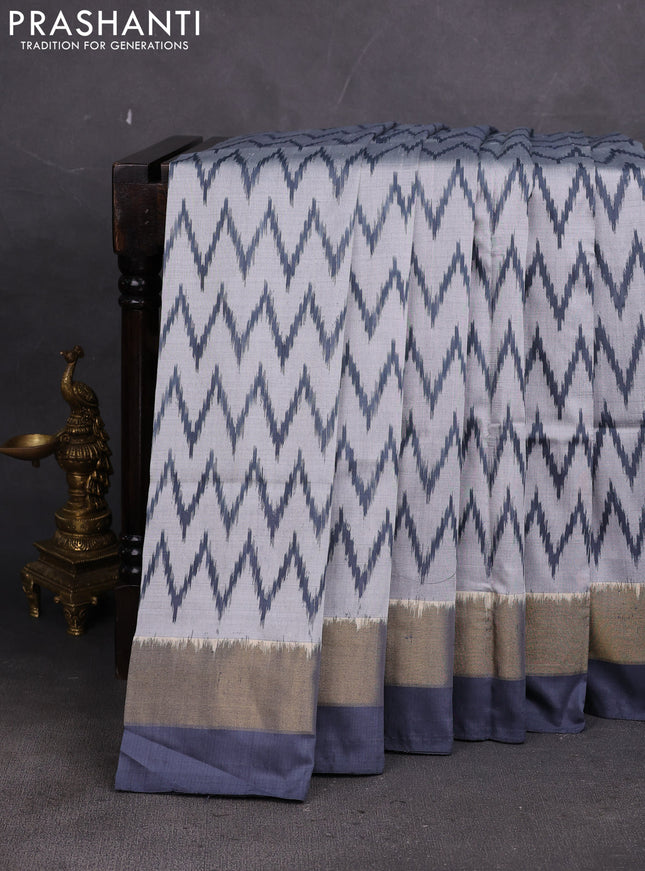 Pochampally silk saree grey with allover ikae weaves and ikat zari wovn border