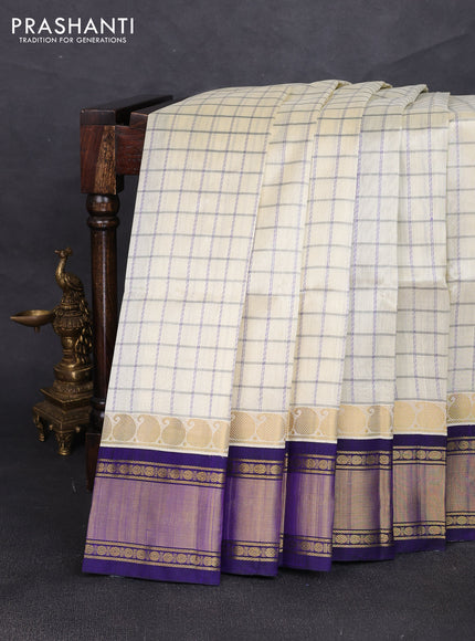 Silk cotton saree cream and royal blue with allover checked pattern and zari woven korvai border