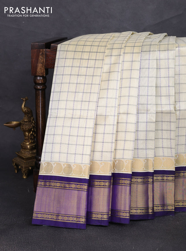Silk cotton saree cream and royal blue with allover checked pattern and zari woven korvai border