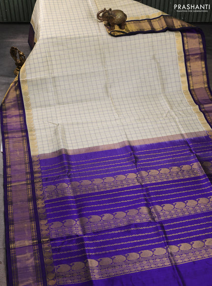 Silk cotton saree cream and royal blue with allover checked pattern and zari woven korvai border