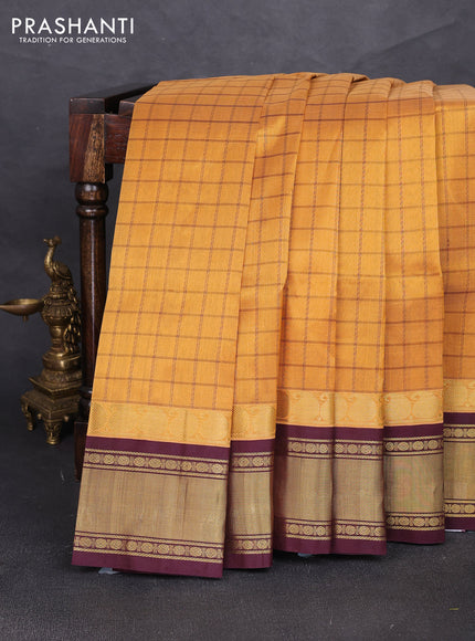Silk cotton saree mustard yellow and coffee brown with allover checked pattern and zari woven korvai border