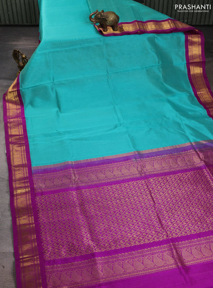 Silk cotton saree teal blue and purple with allover zari vairaosi pattern and zari woven korvai border