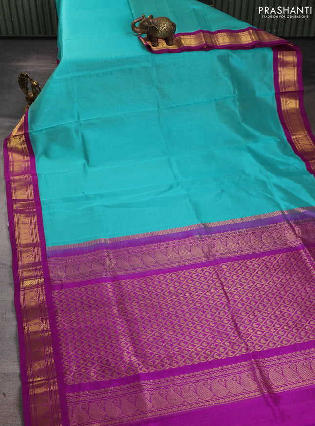 Silk cotton saree teal blue and purple with allover zari vairaosi pattern and zari woven korvai border
